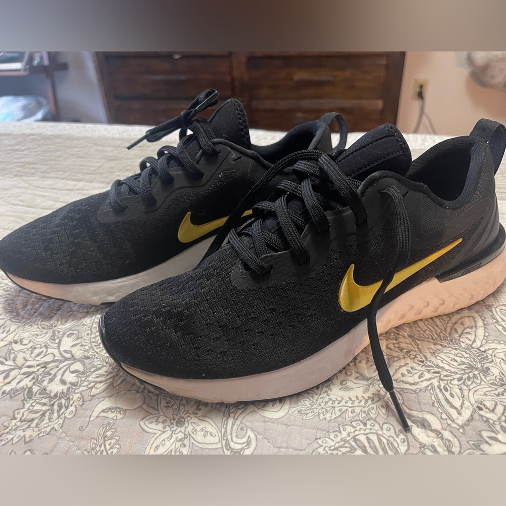 Woman’s Nike Olympic react running shoe size 9